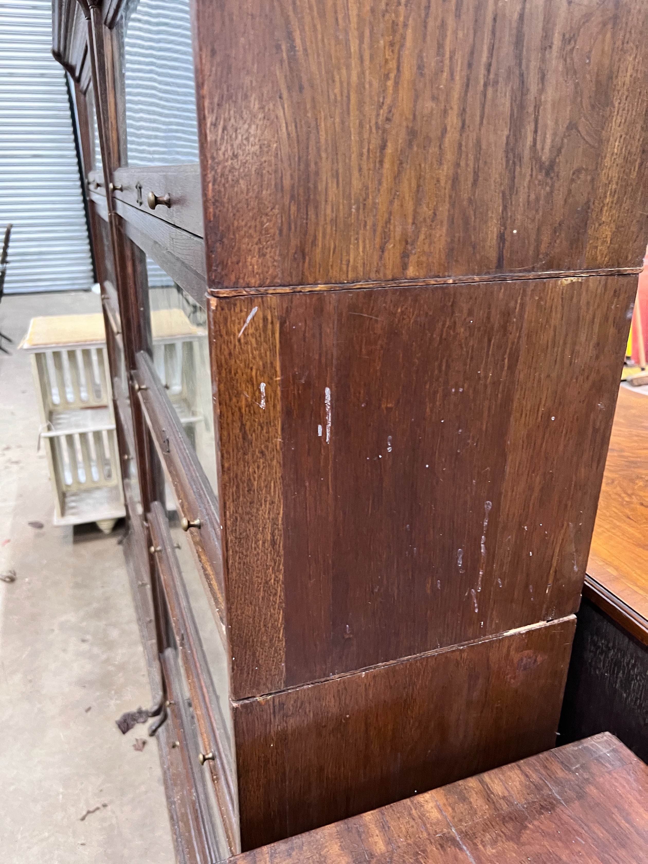 A pair of Edwardian two tier oak Lebus four section bookcases, width 89cm, depth 36cm, height 166cm
